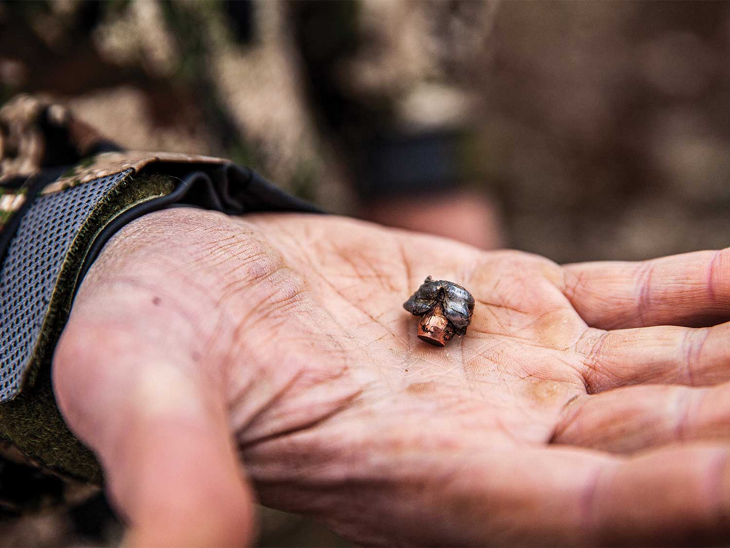 a spent bullet in a hand