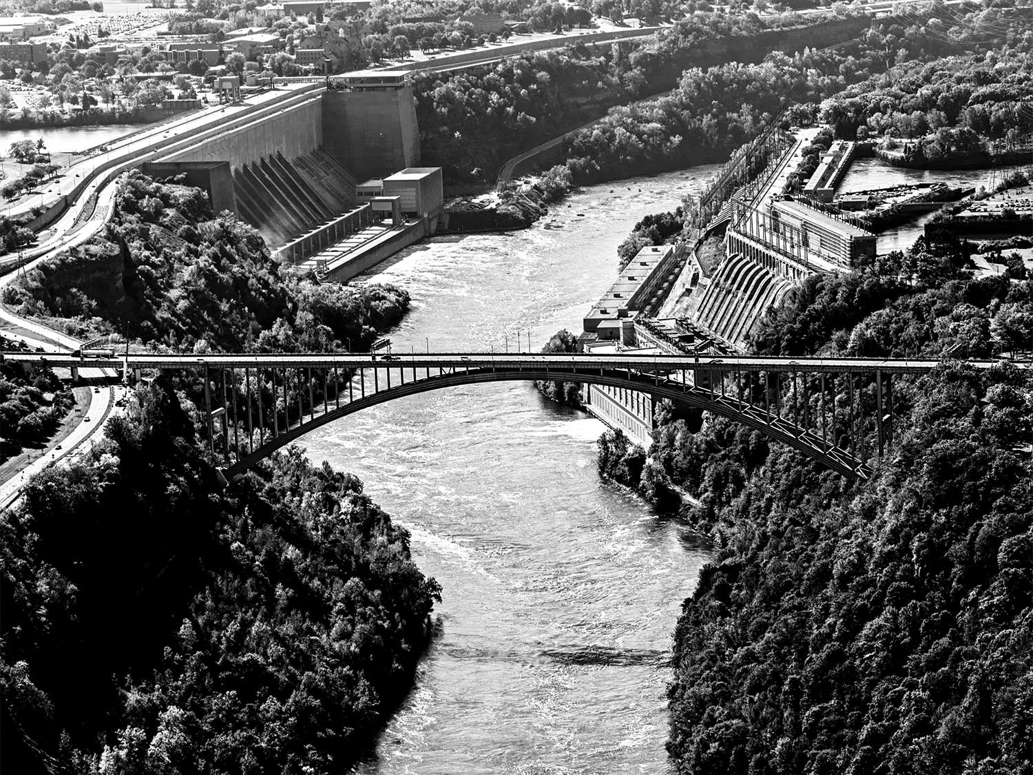 black and white photo of niagra gorge bridge