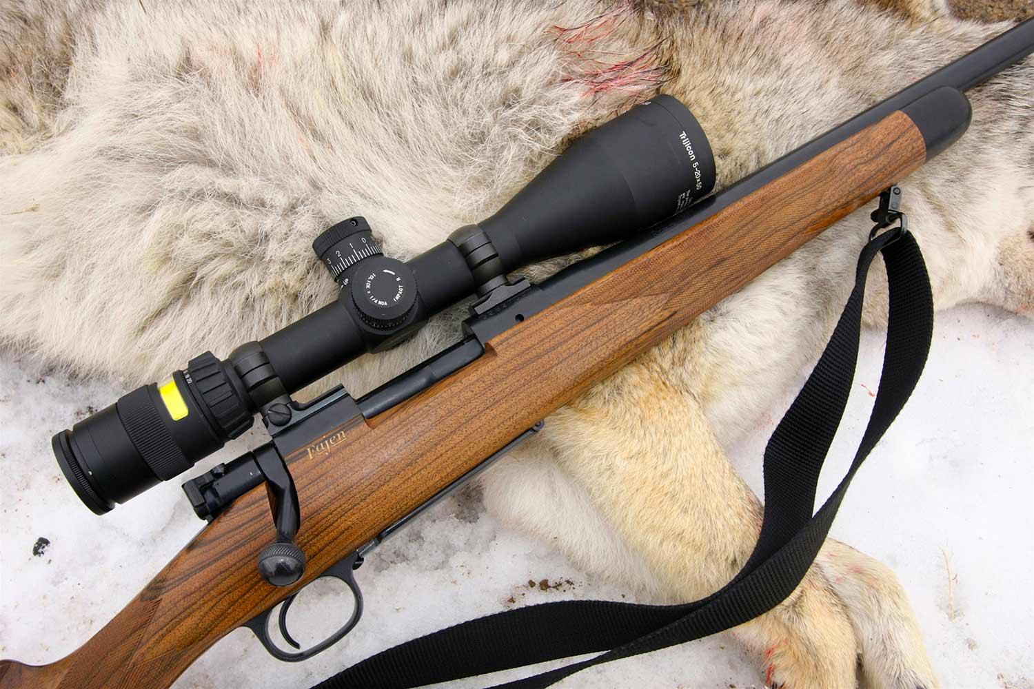 hunting rifle equipped with a Trijicon scope.