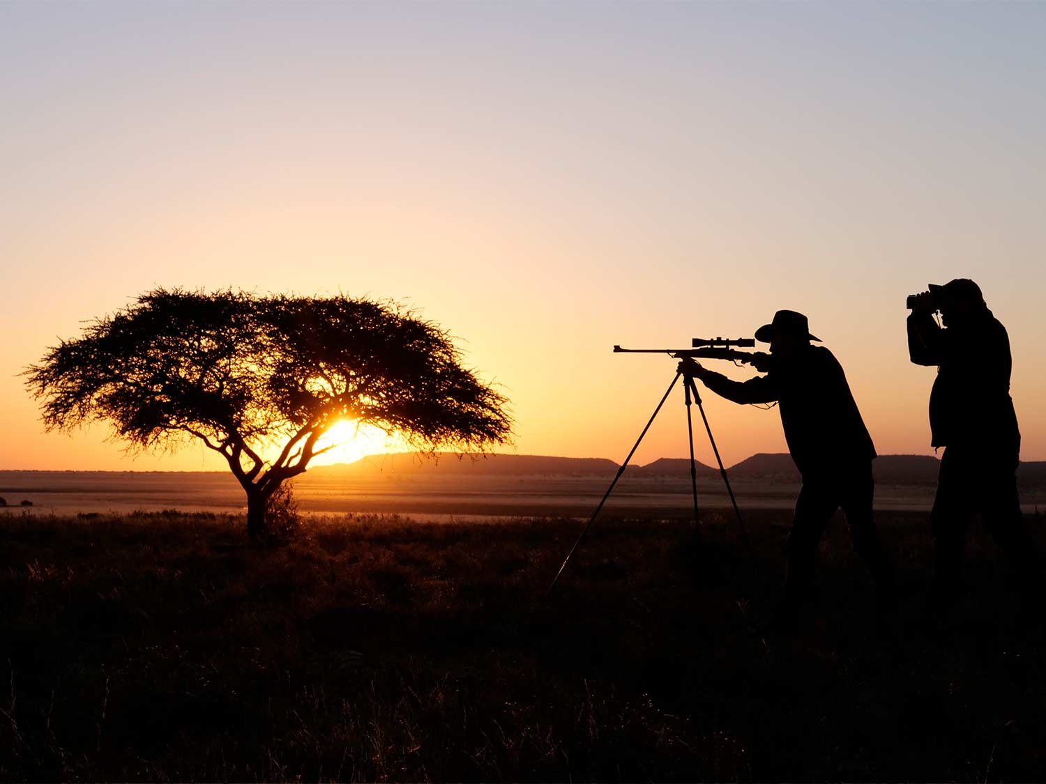 Hunters in Africa during the sunset.