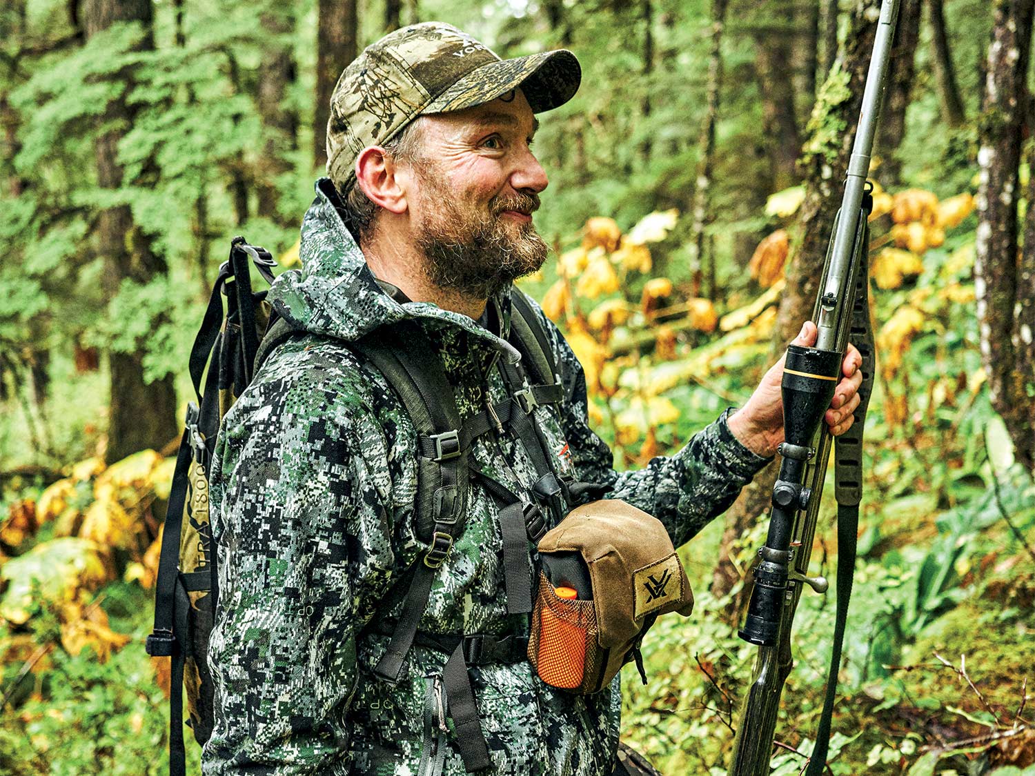 A hunter smiling while hunting in Tongass National Forest.