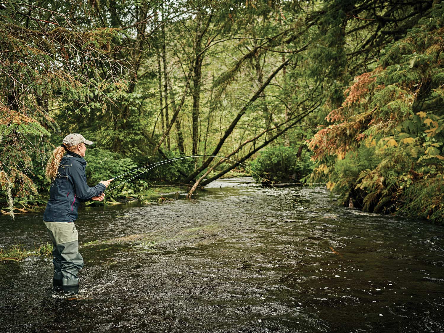 Denise Kaelke fights a Dolly Varden in Tongass National Forest.