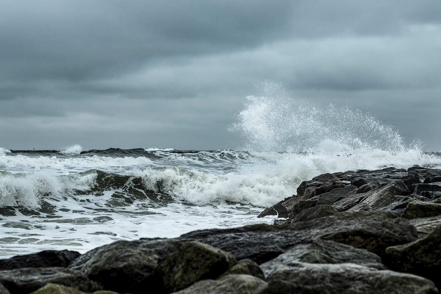 Waves splashing against rocks on the New England coastline.