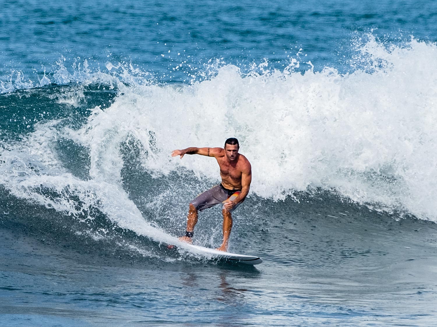 Lance Clinton rides the waves in Costa Rica.