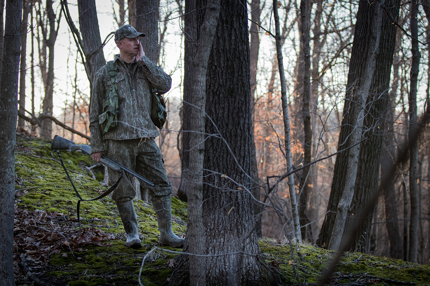 Hunter calling a turkey in the woods.