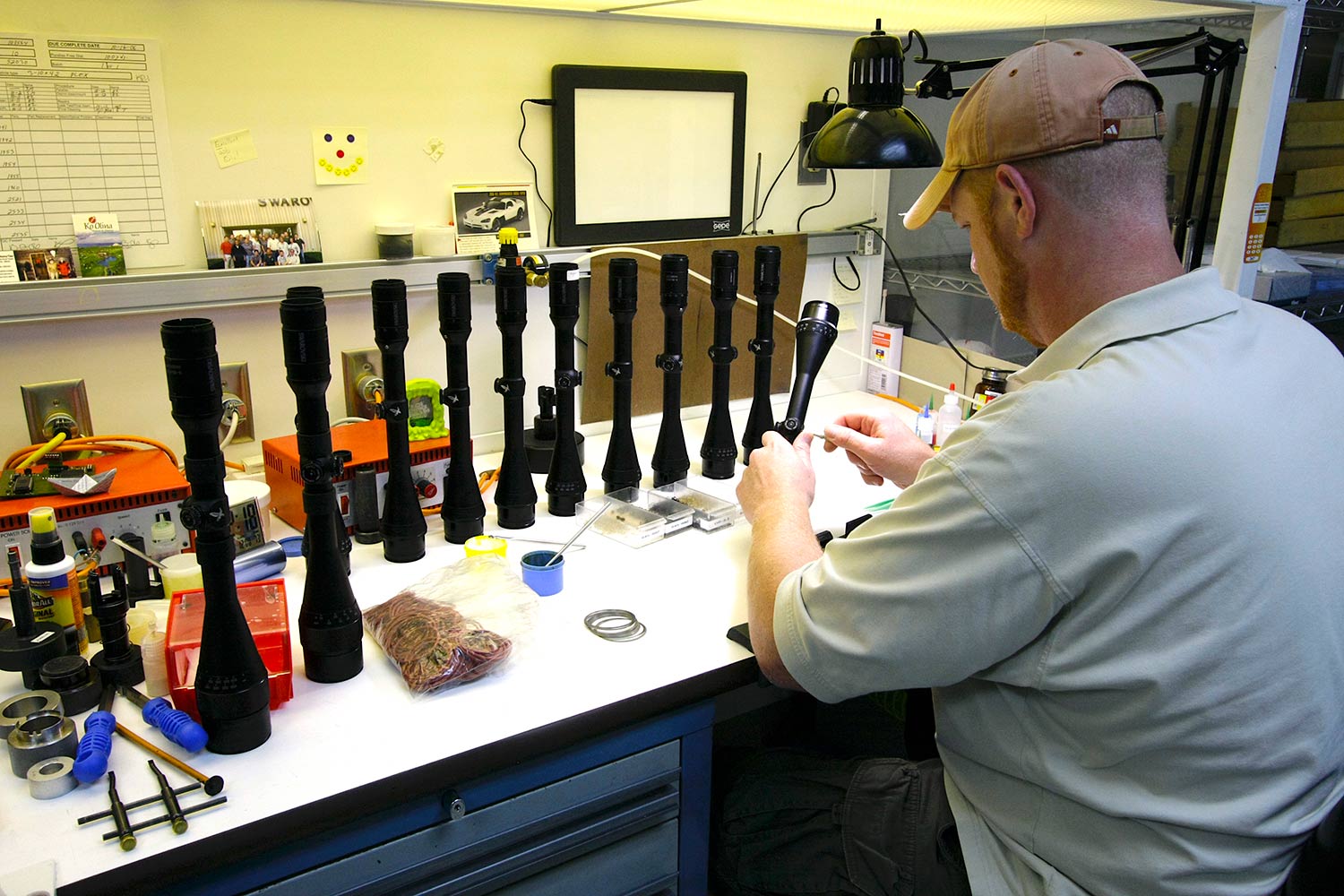 A technician assembles Swarovski riflescopes.