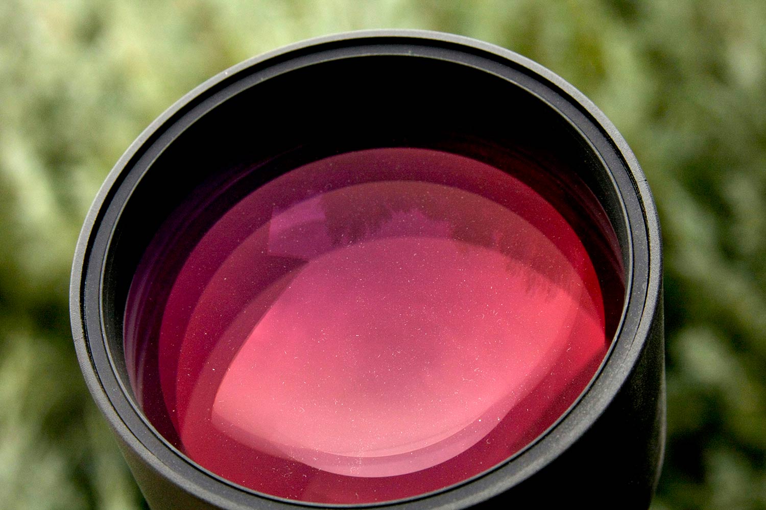 A rose tinted riflescope lens.