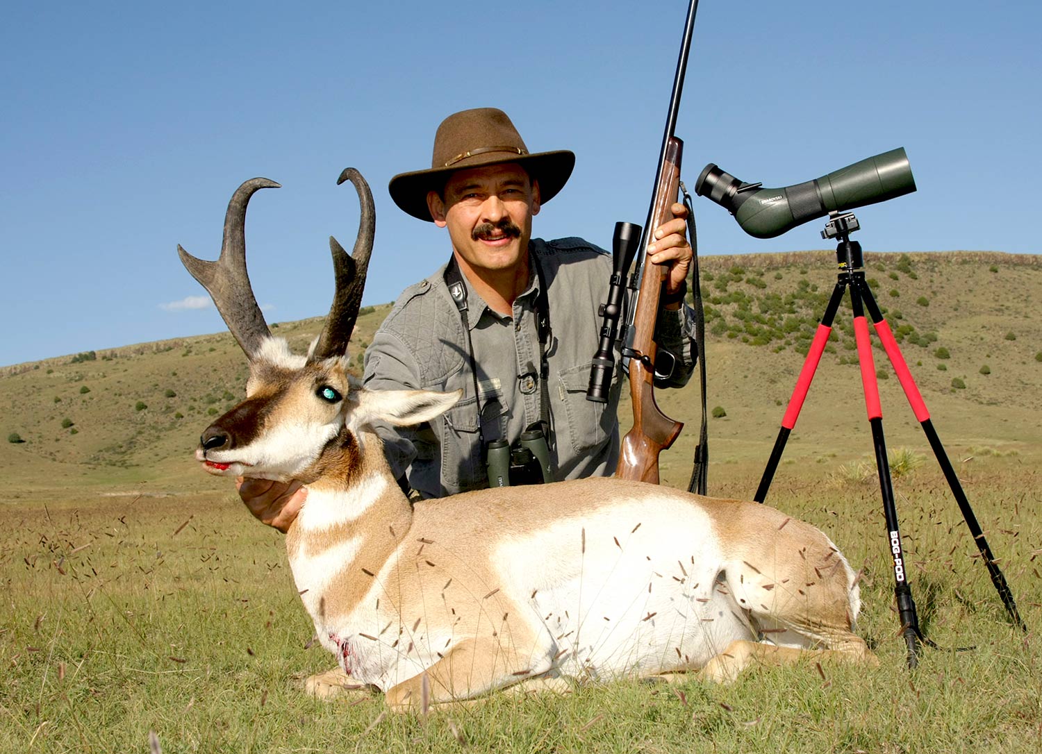 Hunter next to an antelope.