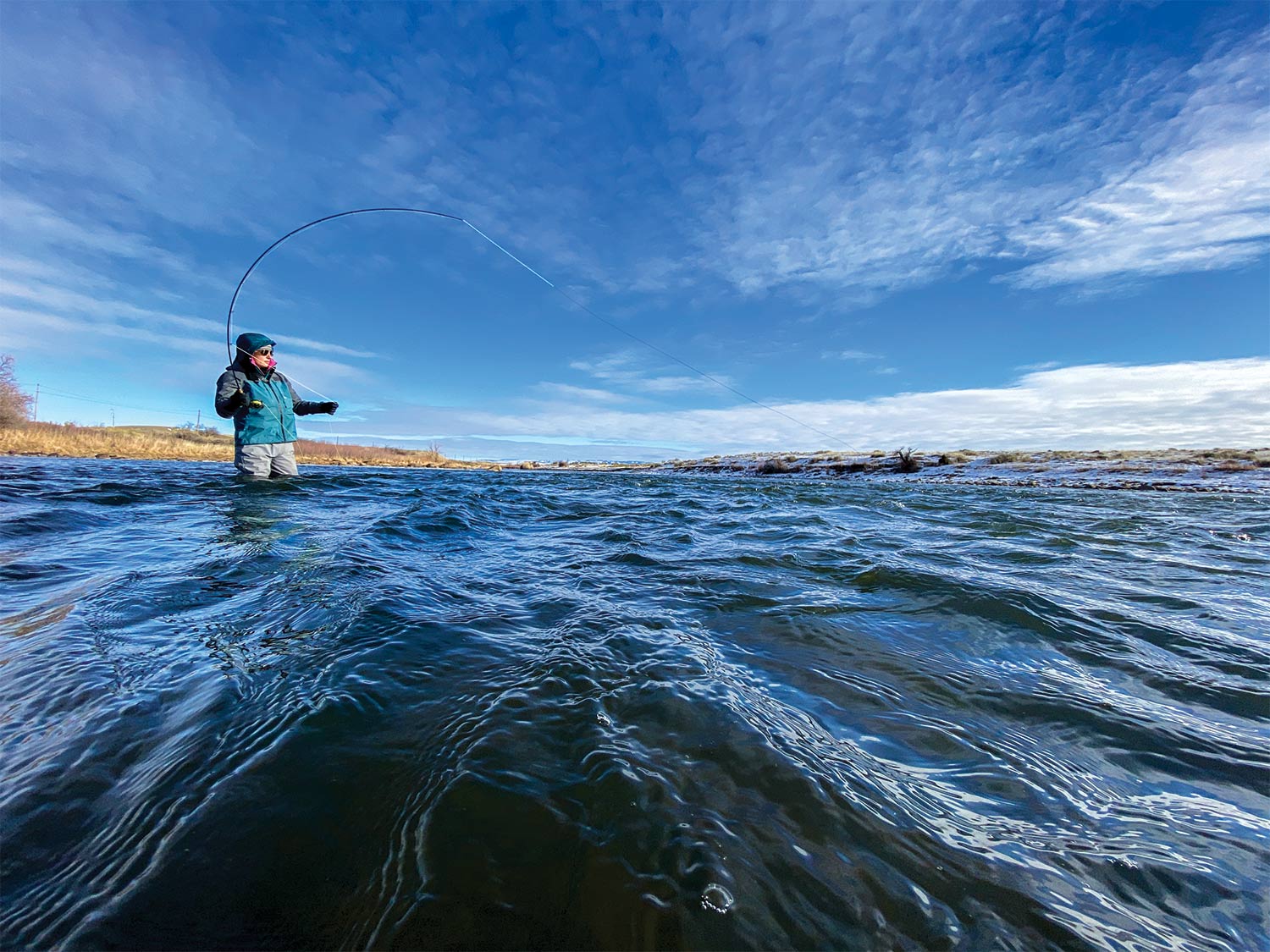 Female angler fishing in Wyoming's North Platte River.