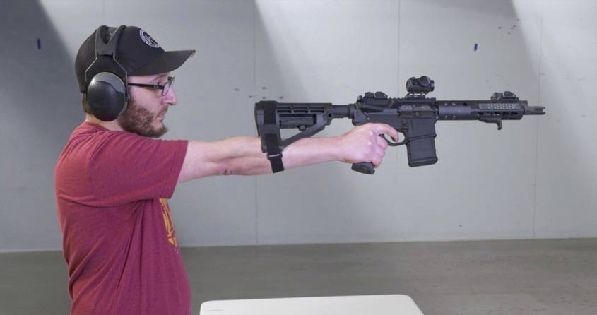 Man aiming SB tactical pistol