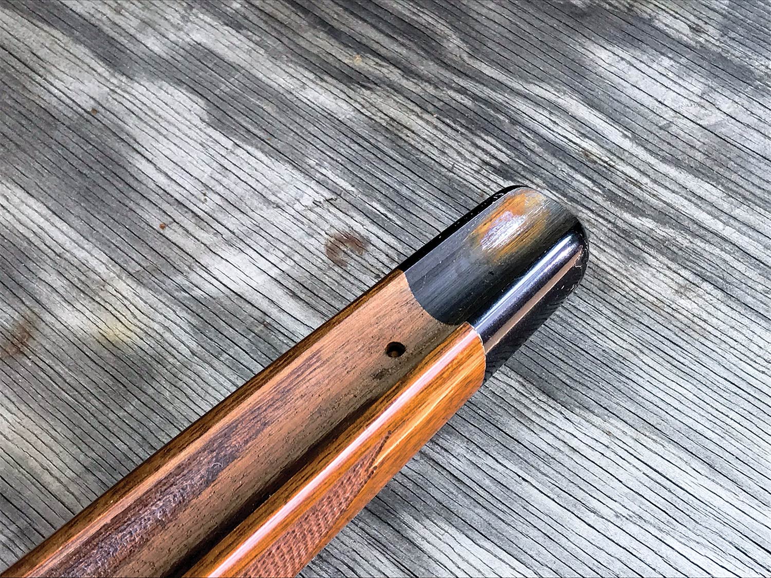 The shiny spot of a rifle barrel.