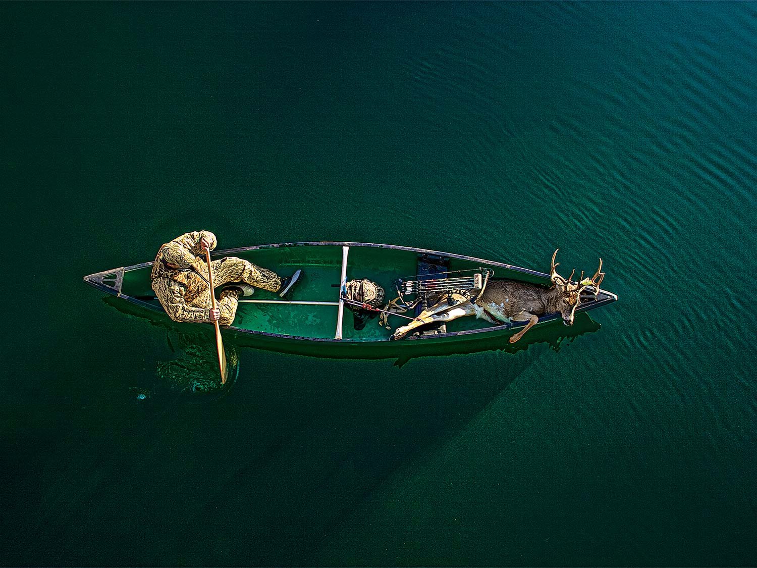 deer hunter and canoe.