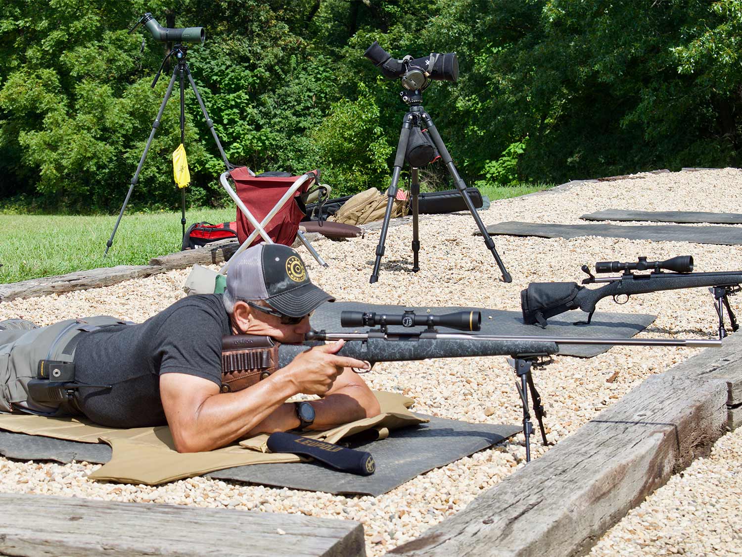 Jim Kauber aiming a rifle.