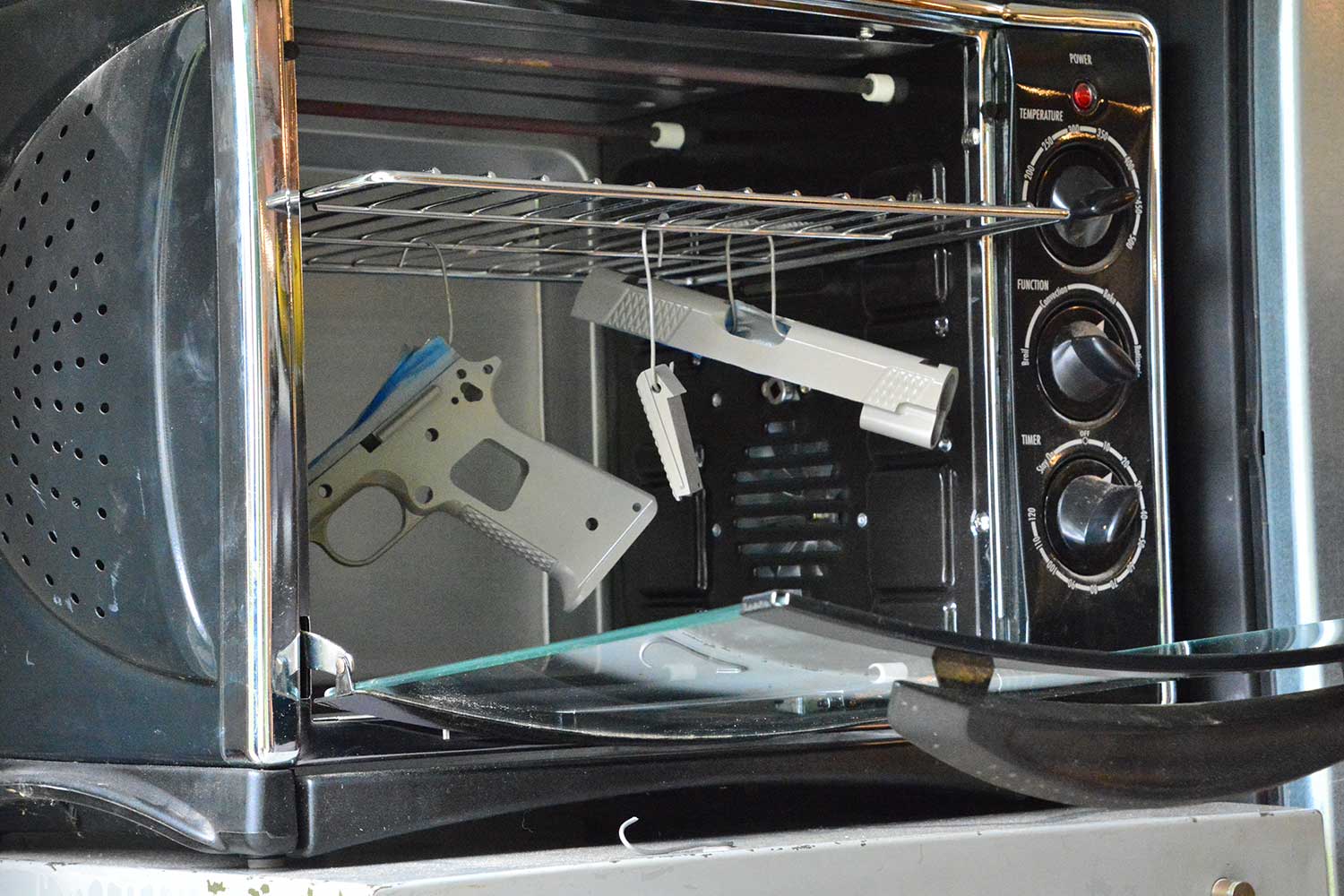 Gun parts  drying in a convection oven.