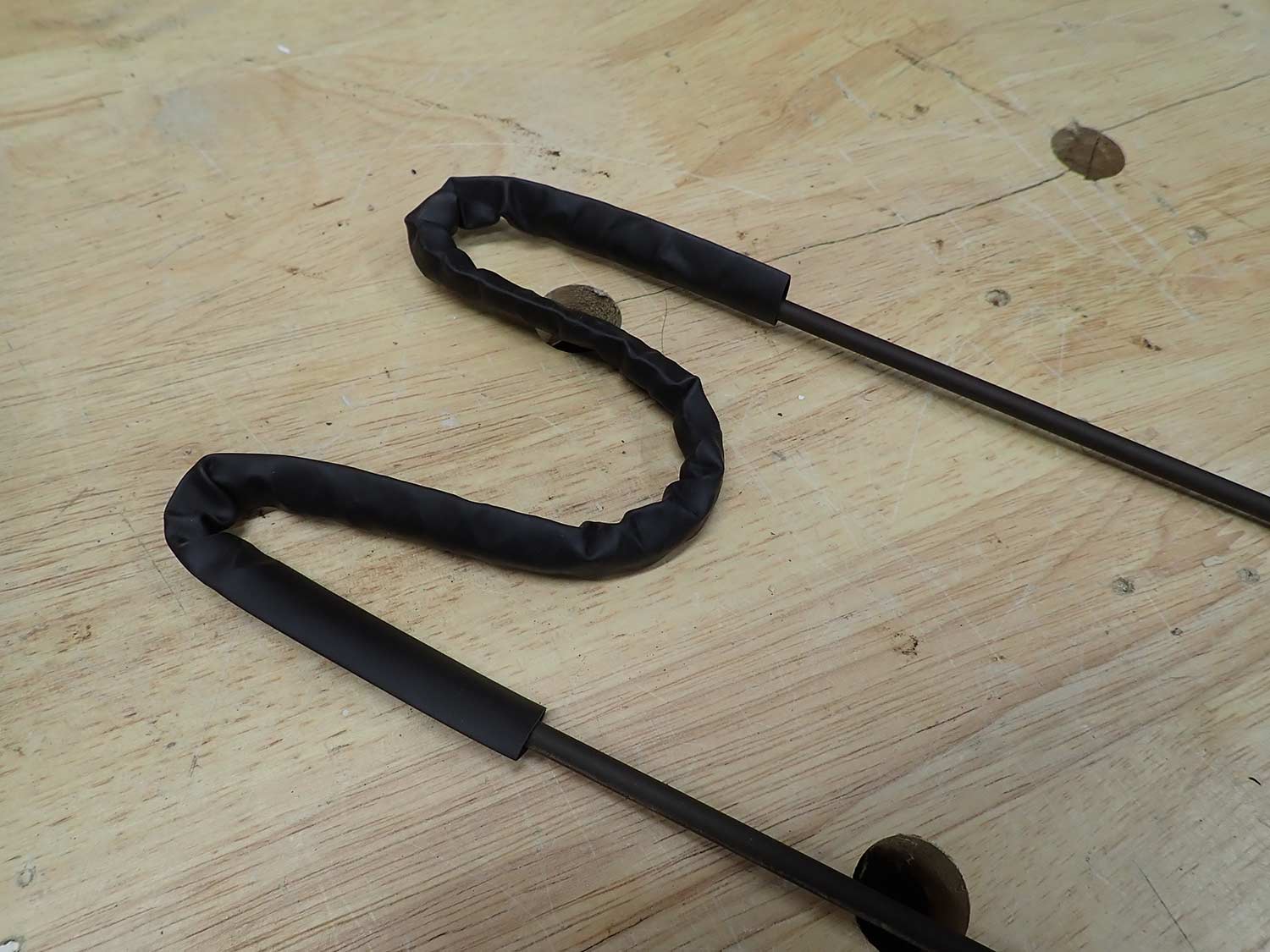 A simple gun rest made from bent wire.