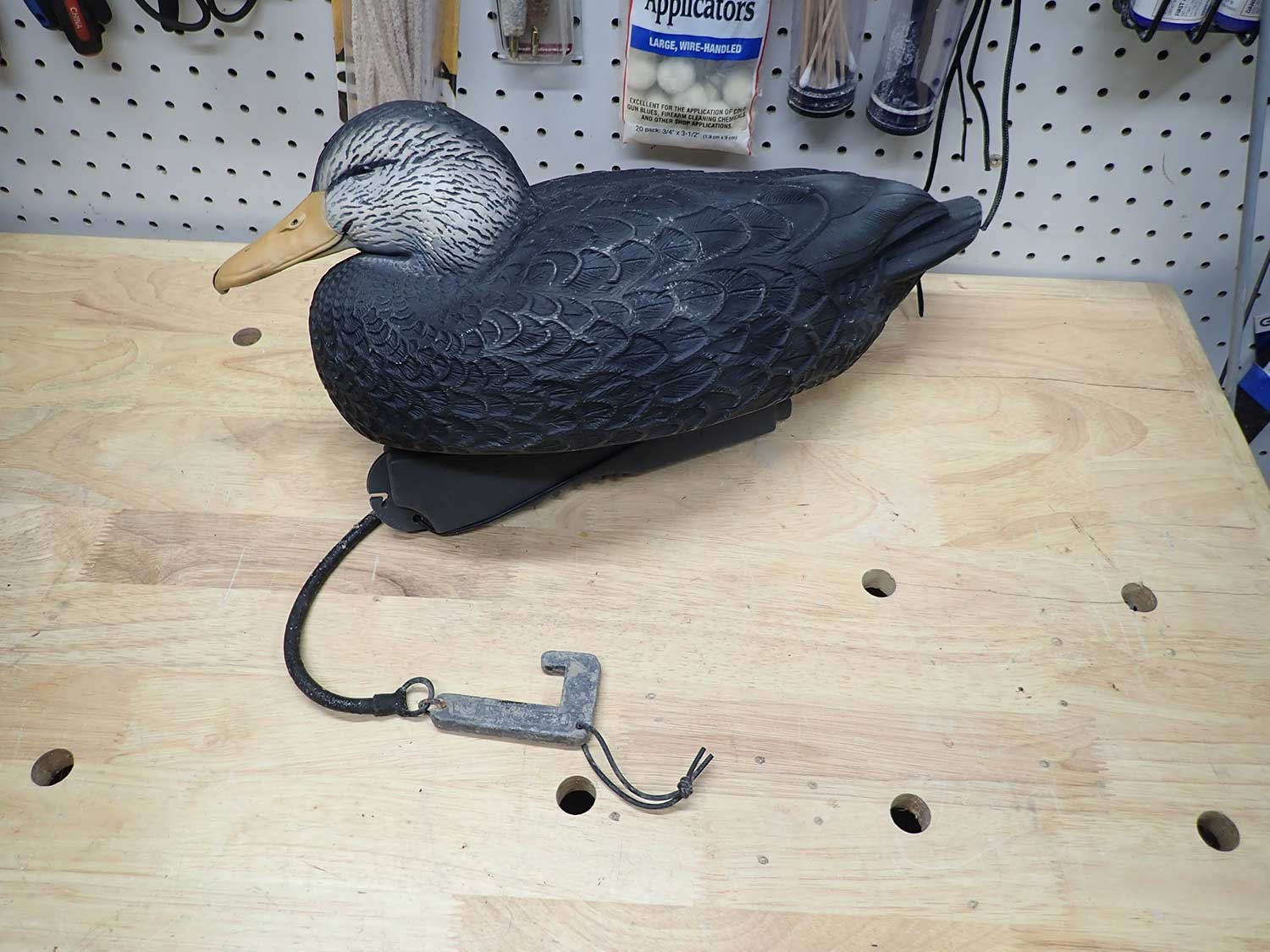 A decoy with a repaired stretch cord.