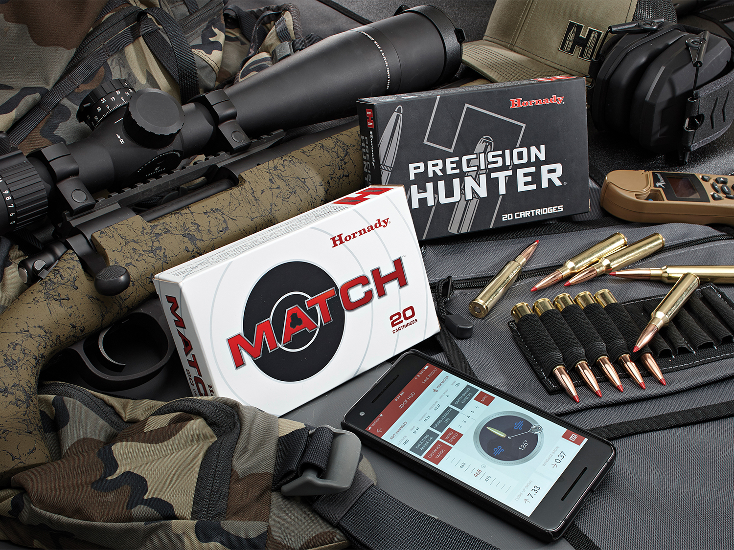 Boxes of rifle ammunition and a shooting ballistics app.