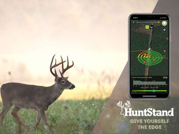 An image of a whitetail buck walking in a field, overlayed with a branding lockup showing the HuntStand app, logo, and tagline: "Give Yourself the Edge"