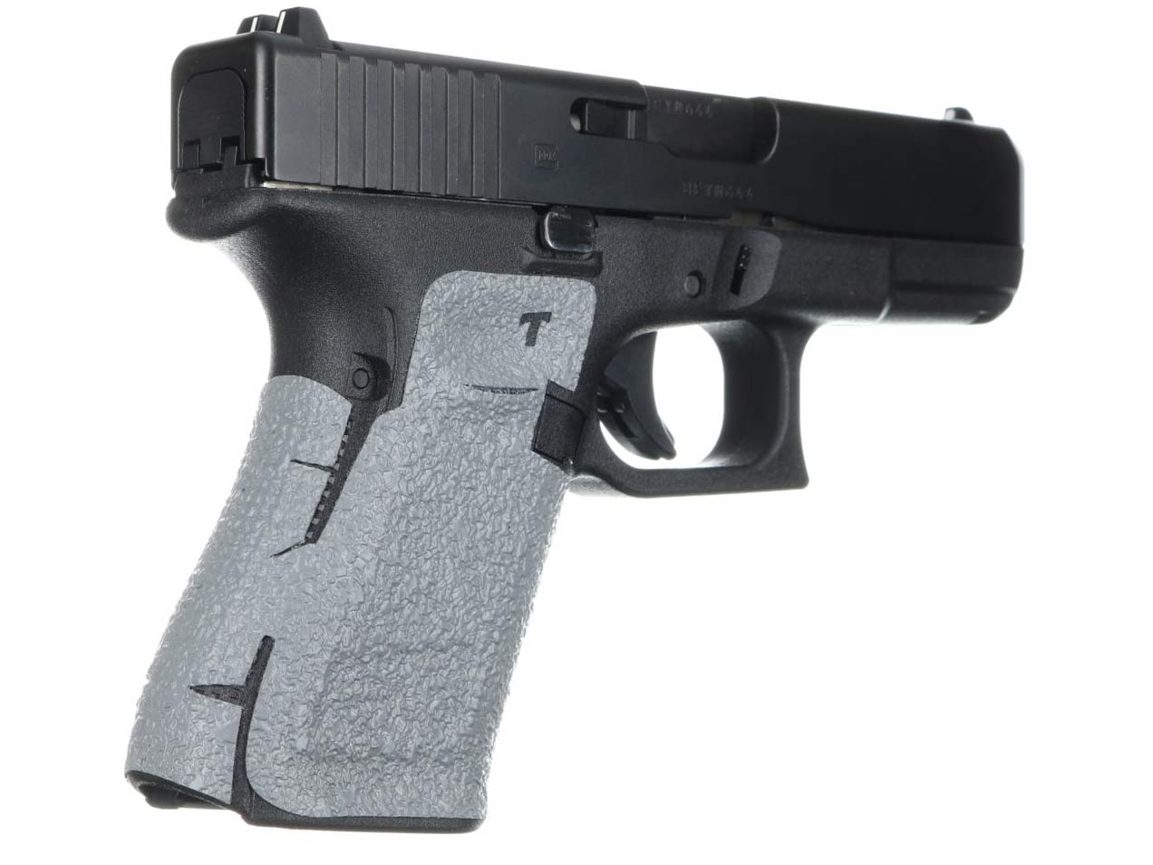A talon grip wrapped around the handle of a handgun.