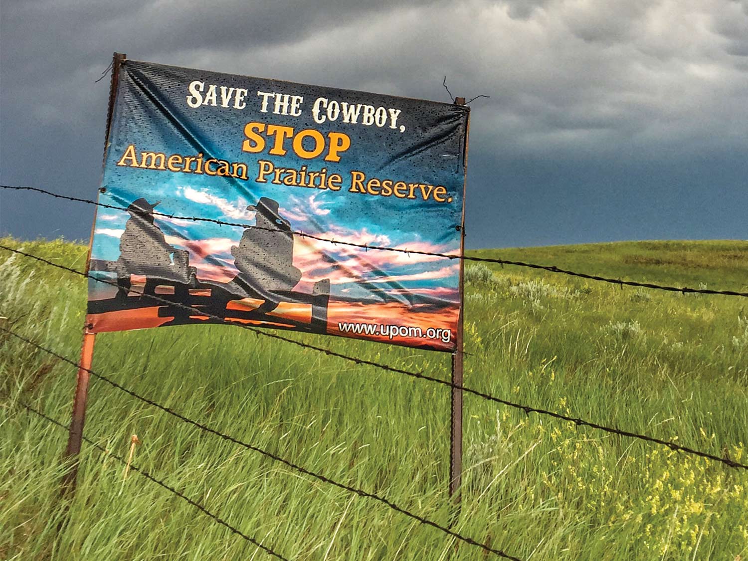 A sign that reads: Save the Cowboy, Stop American Prairie Reserve.