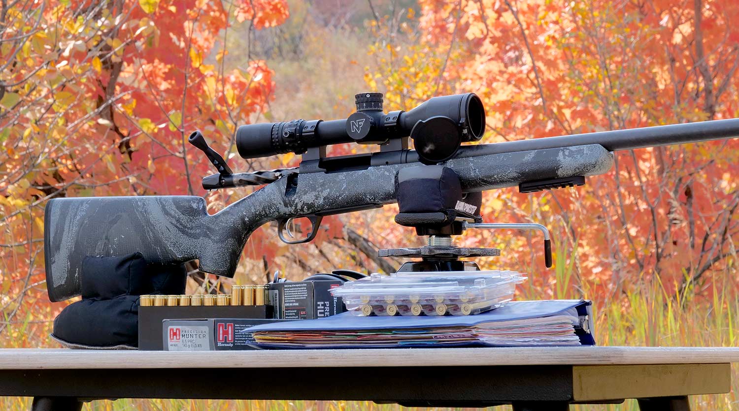 An AllTerra Carbon Rifle propped up on a stand on a table.