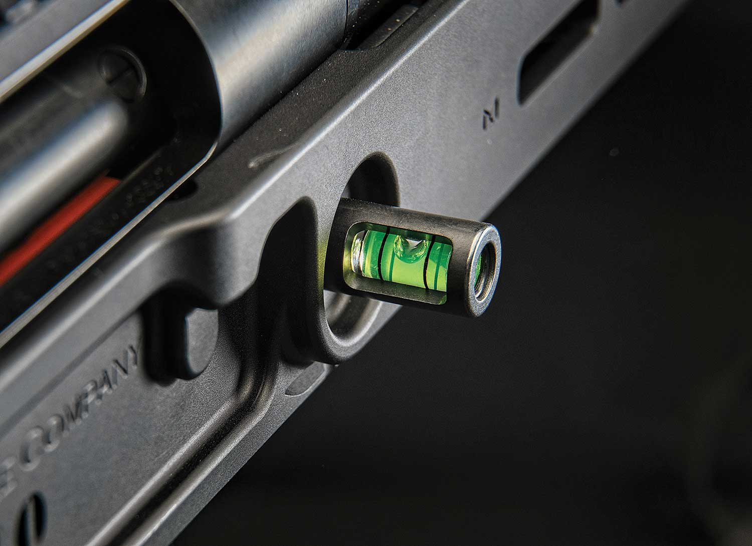 A bubble level attached to a hunting rifle stock.