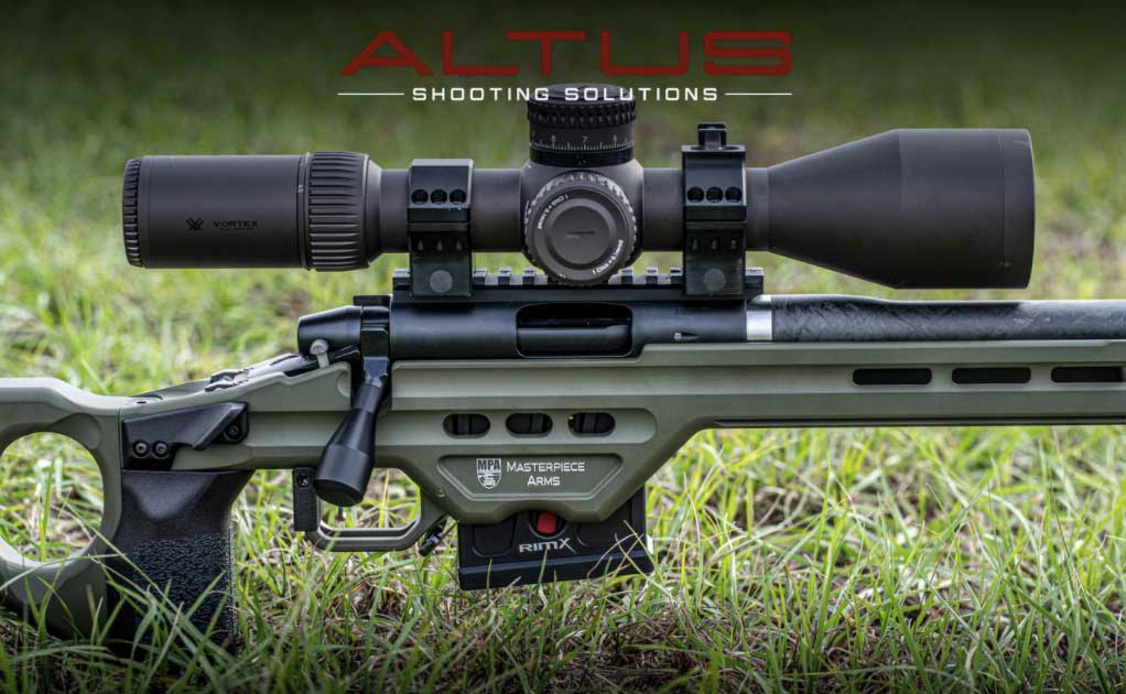 An Altus RimX rifle on a grassy ground.