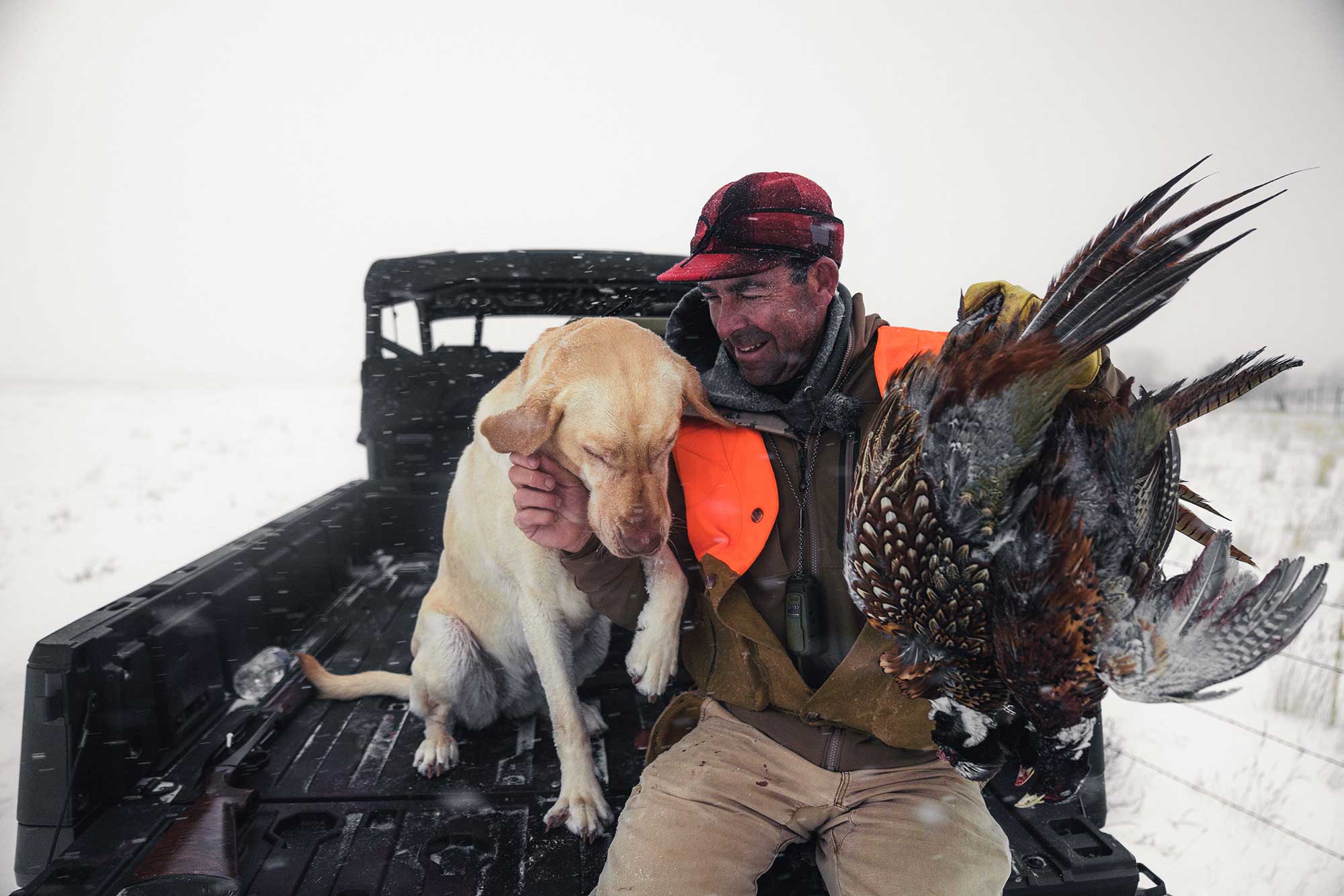 Author, Andrew McKean braces against a cold Montana wind with bird dog Nellie.
