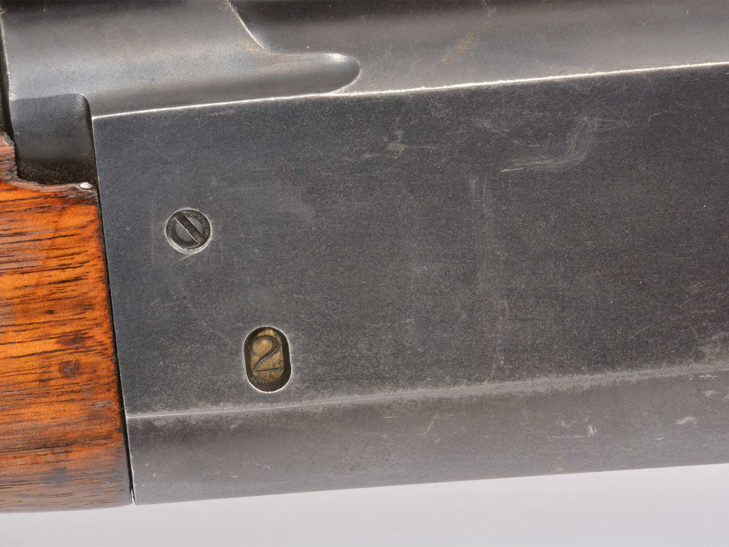 A rotary magazine indicator of remaining bullets in the side of the Savage Model 99 lever action rifle.