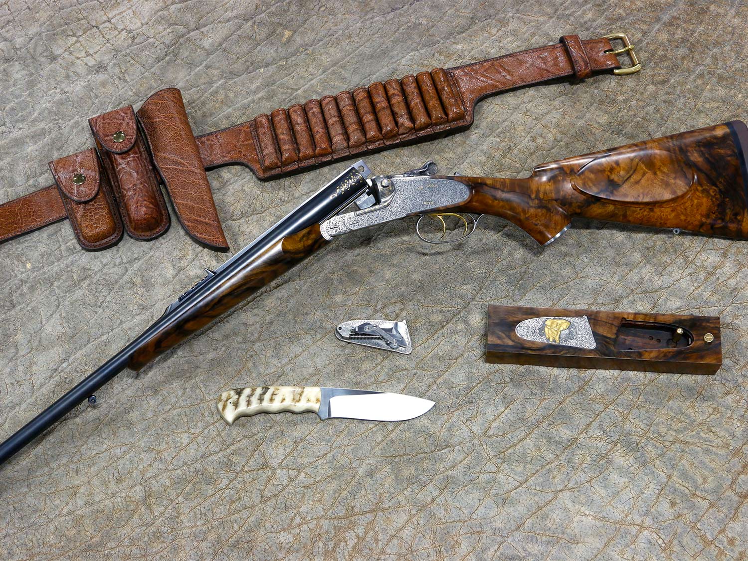 Collection of hunting gear and rifle.