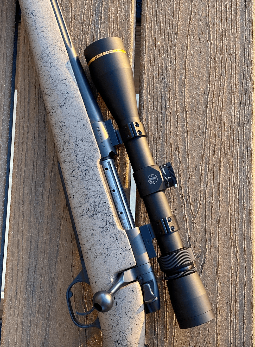 A gray coyote rifle topped with the new Leupold VX-3HD.