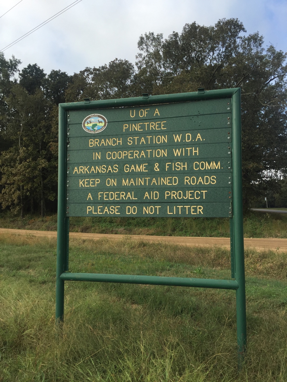 A sign at the Pine Tree Research Station, a chunk of public land in eastern Arkansas that the university is trying to sell.