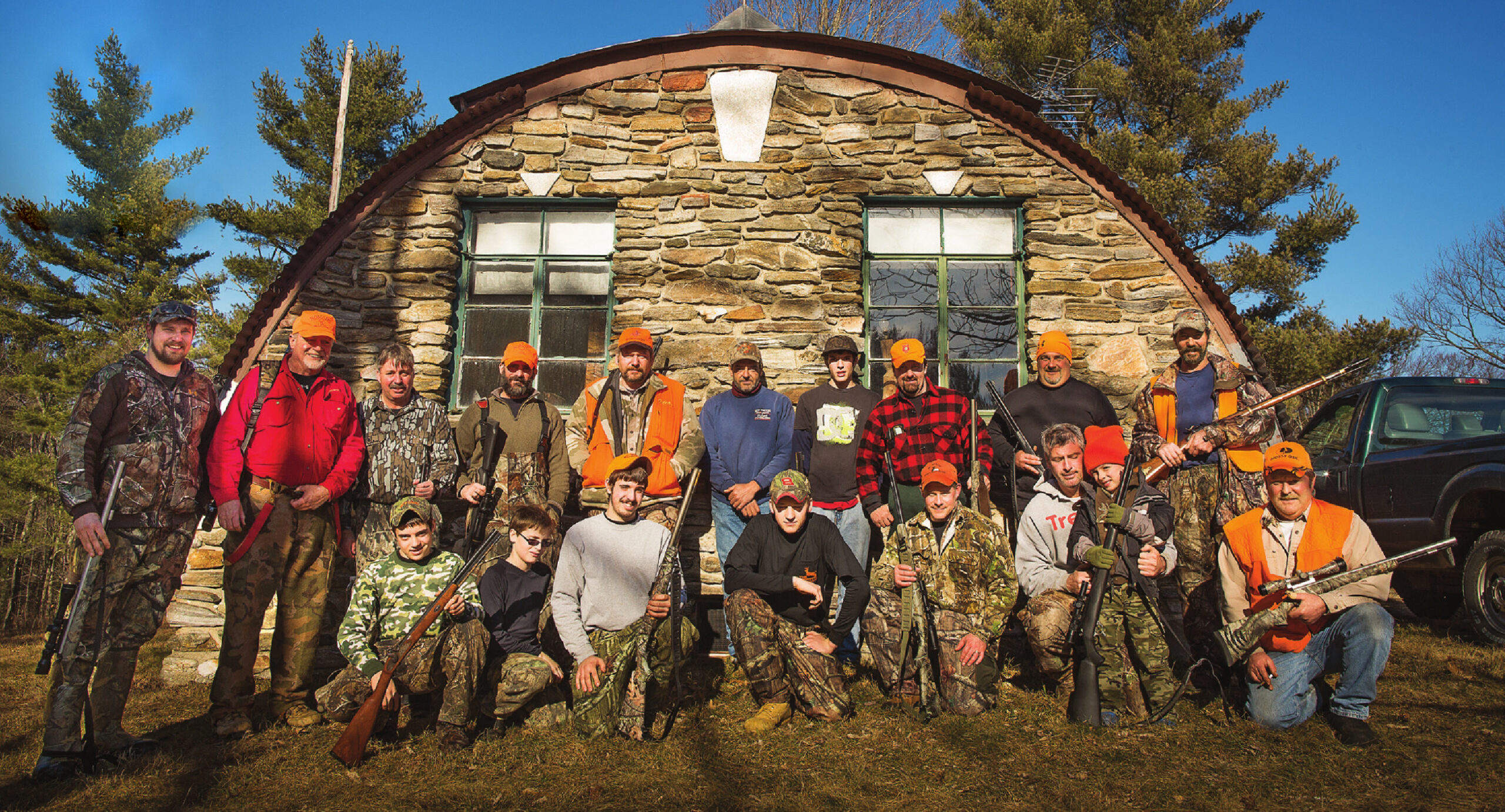 A group of New England deer hunters at their deer camp.