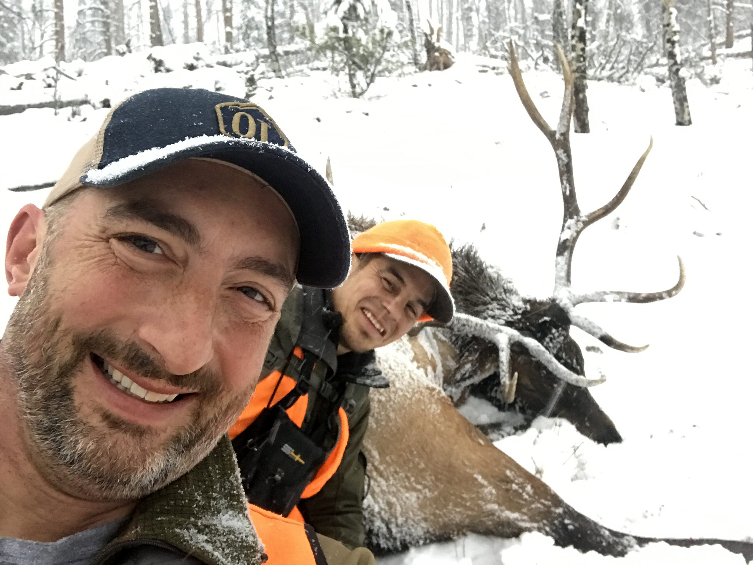 Two hunting buddies take a selfie with a great public-land bull