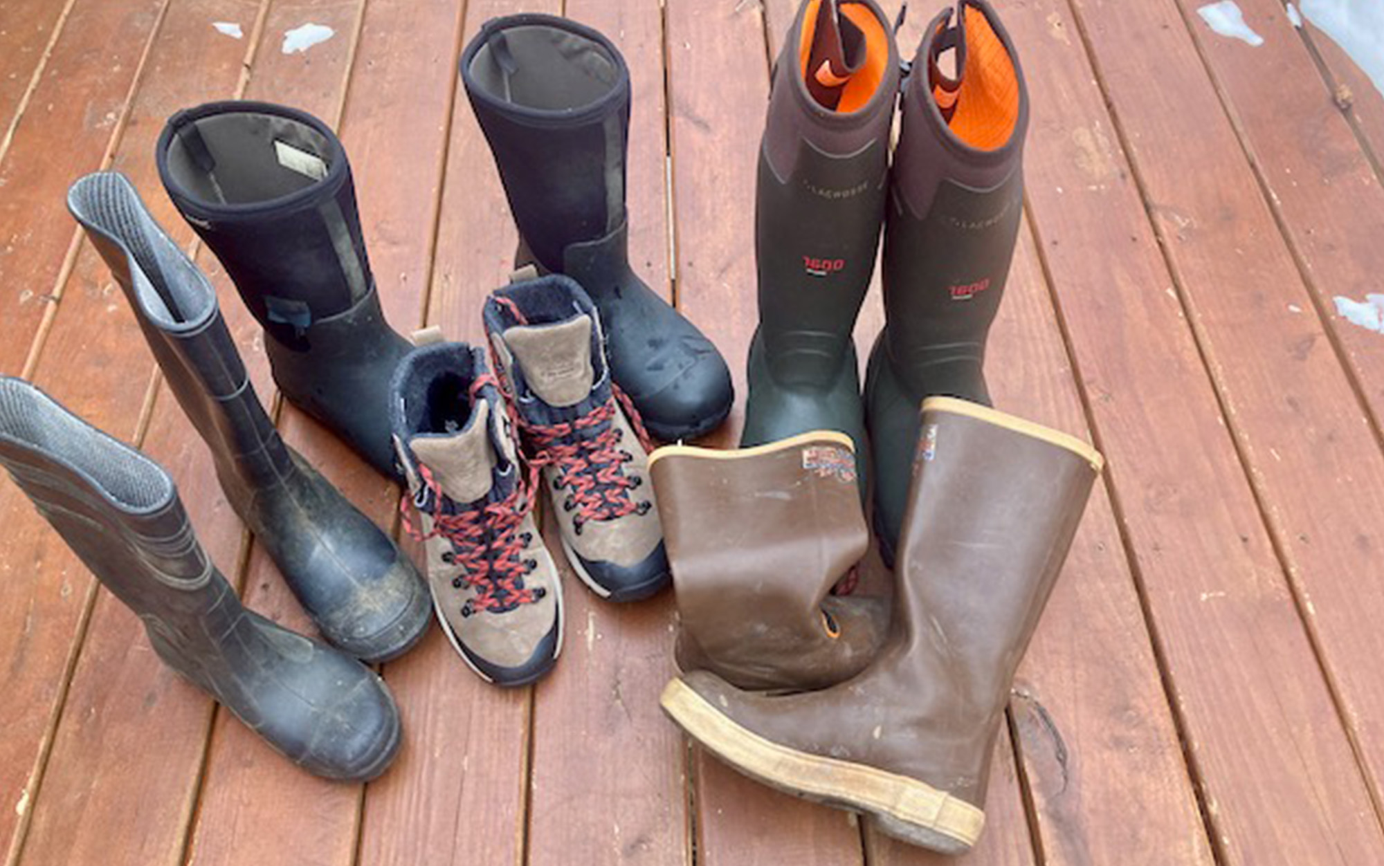 The best men's waterproof boots sit in a pile.