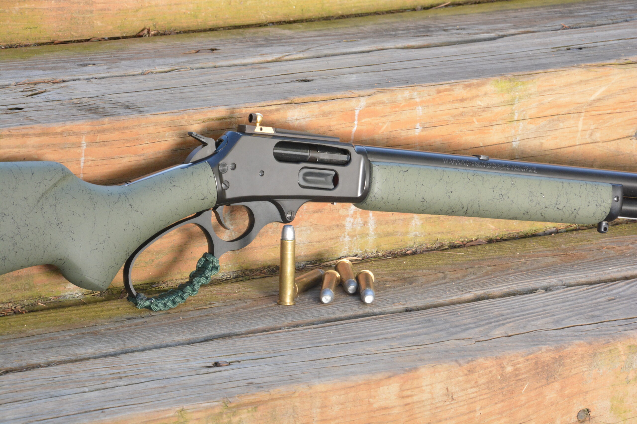 A greenish Marlin 1894 lever action is a classic cowboy rifle.