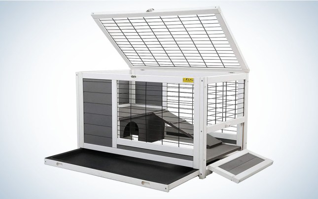 A white and gray bunny hutch with a removable tray and wire fencing.