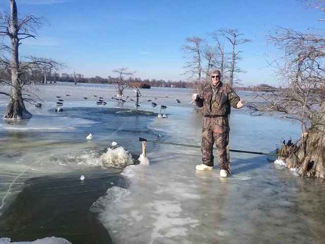 Vowell standing on the ice of Reelfoot Lake.