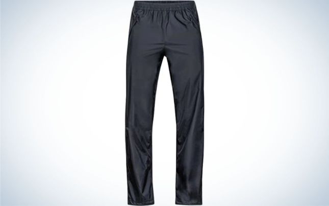 A pair of light gray long pants and material that has shine.