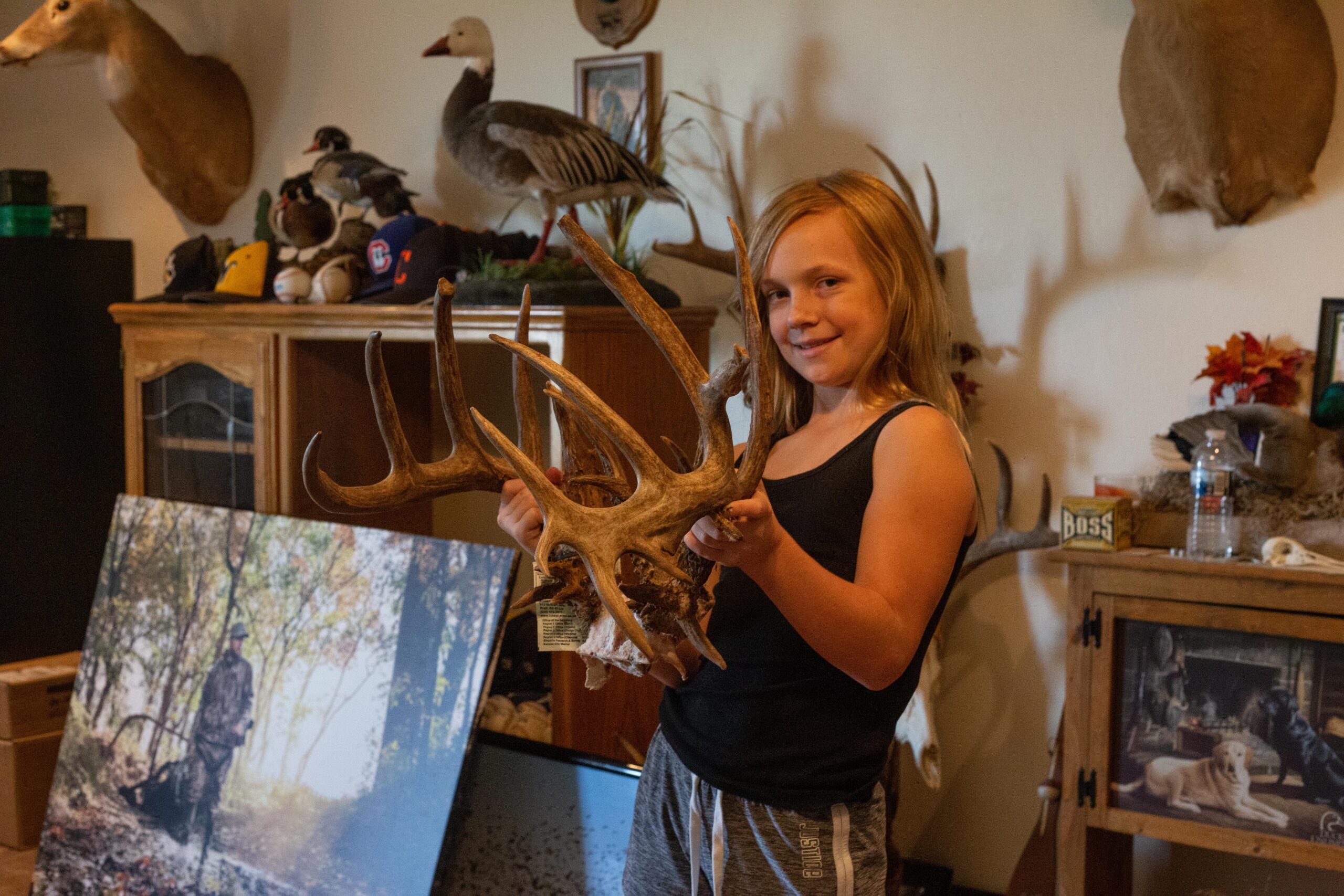 Ell Perkins hold up the rack from her 200-inch whitetail.