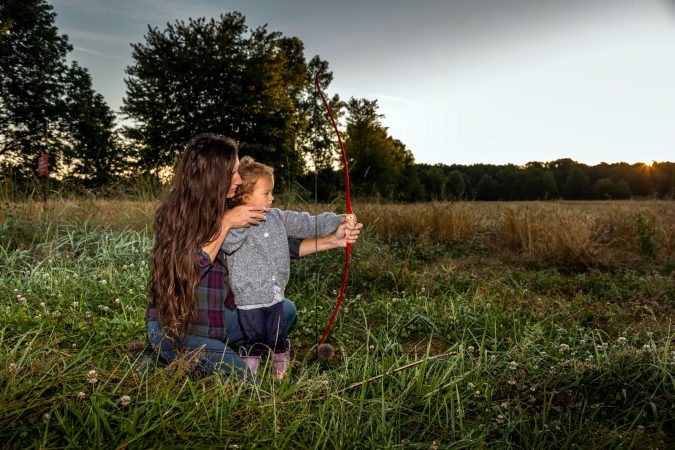 Beka Garris and her daughter shoot a recurve bow.