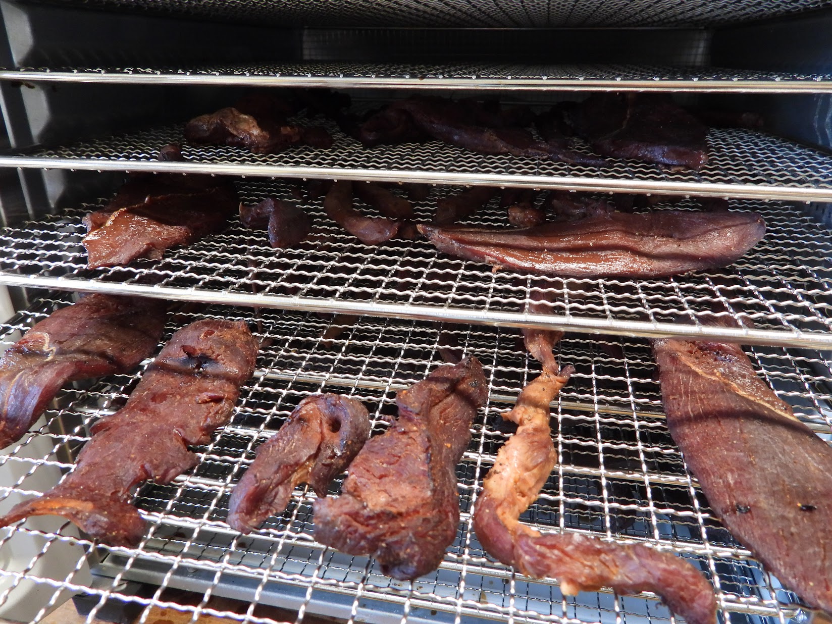 Jerky laid on trays in a dehydrator