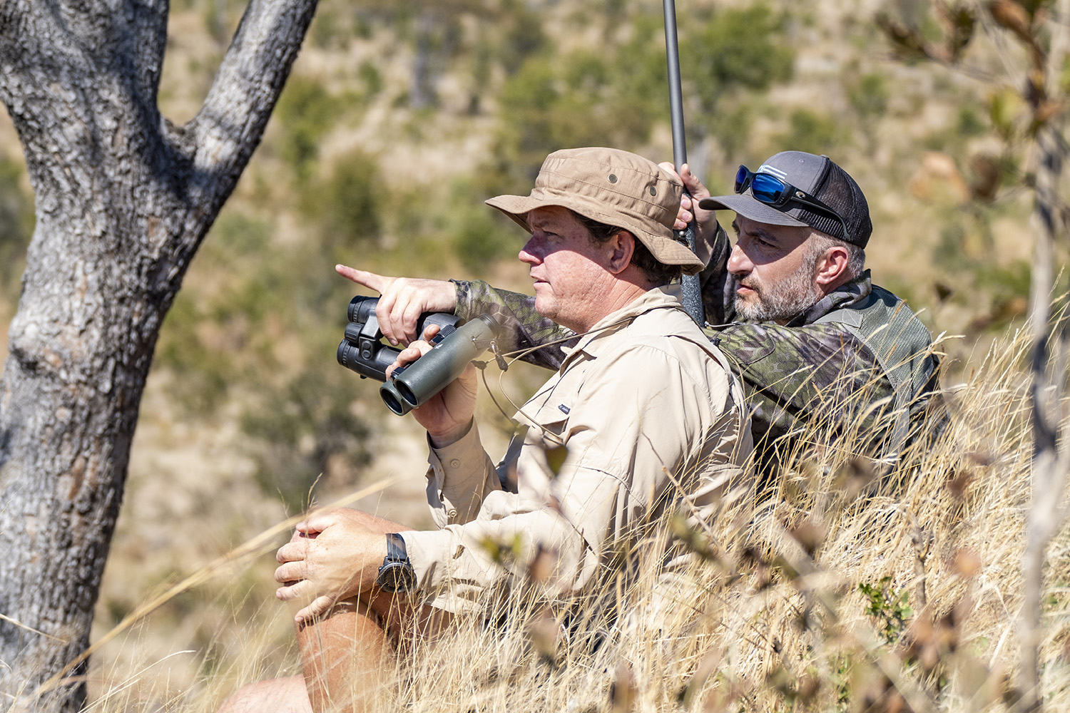 The author (right) and PH Rob Lurie look for Cape buffalo in Zimbabwe.