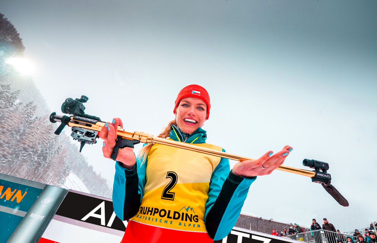 athlete holding biathlon rifle barreled action