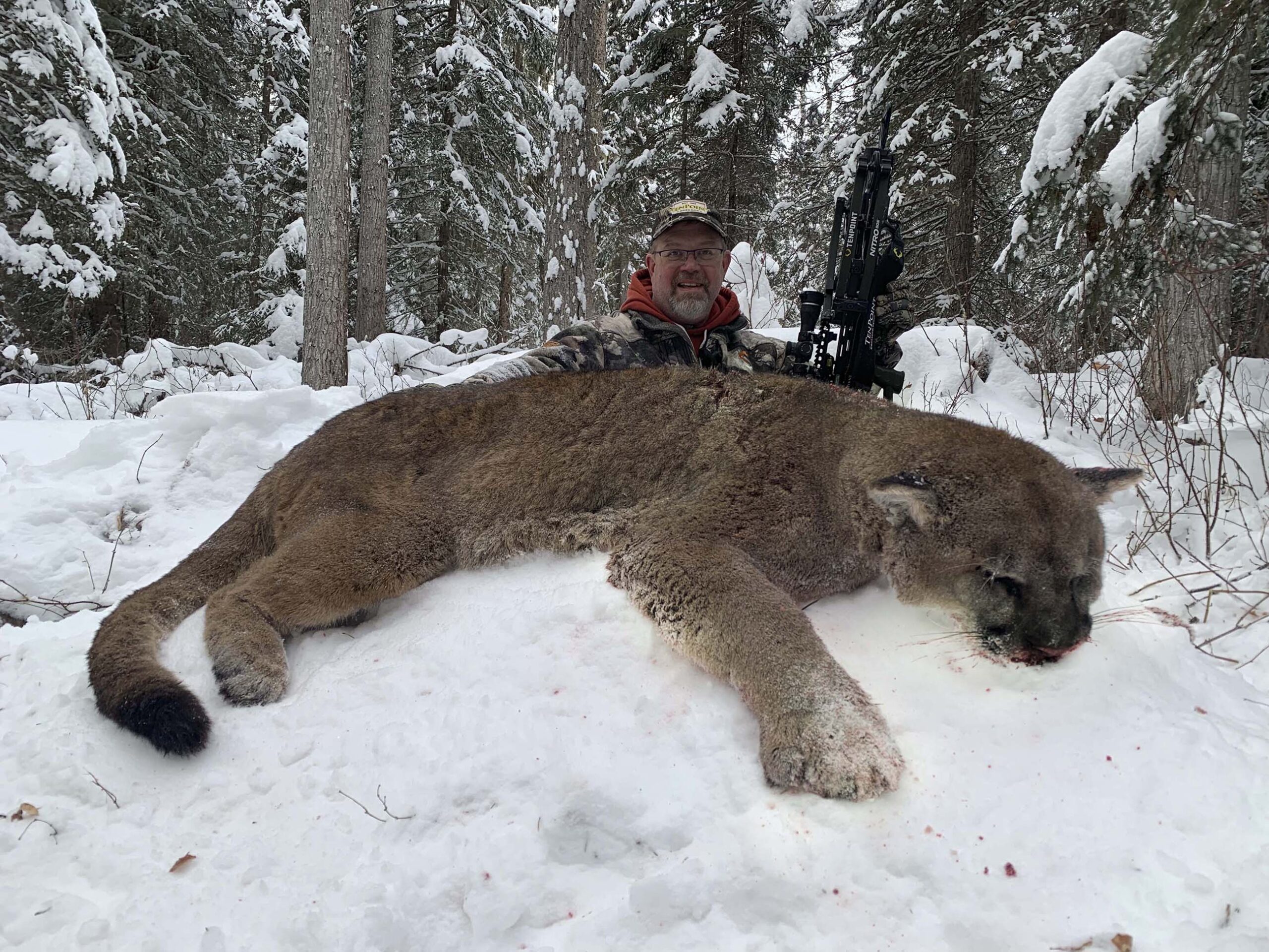 hunter with mountain lion