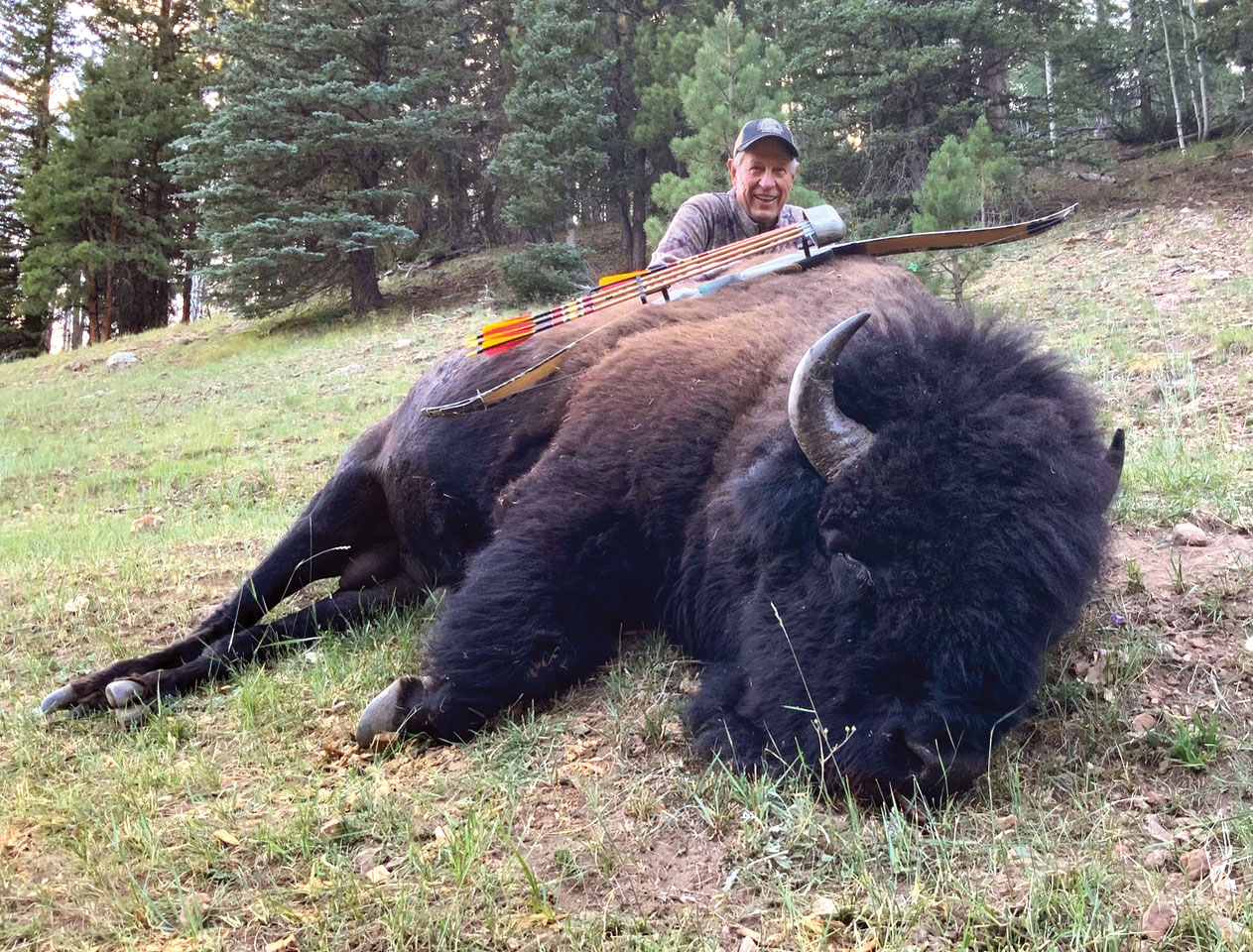 hunter with a bison