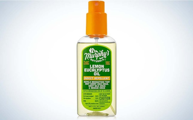 A clear bottle of best tick repellent with an orange cap and green label