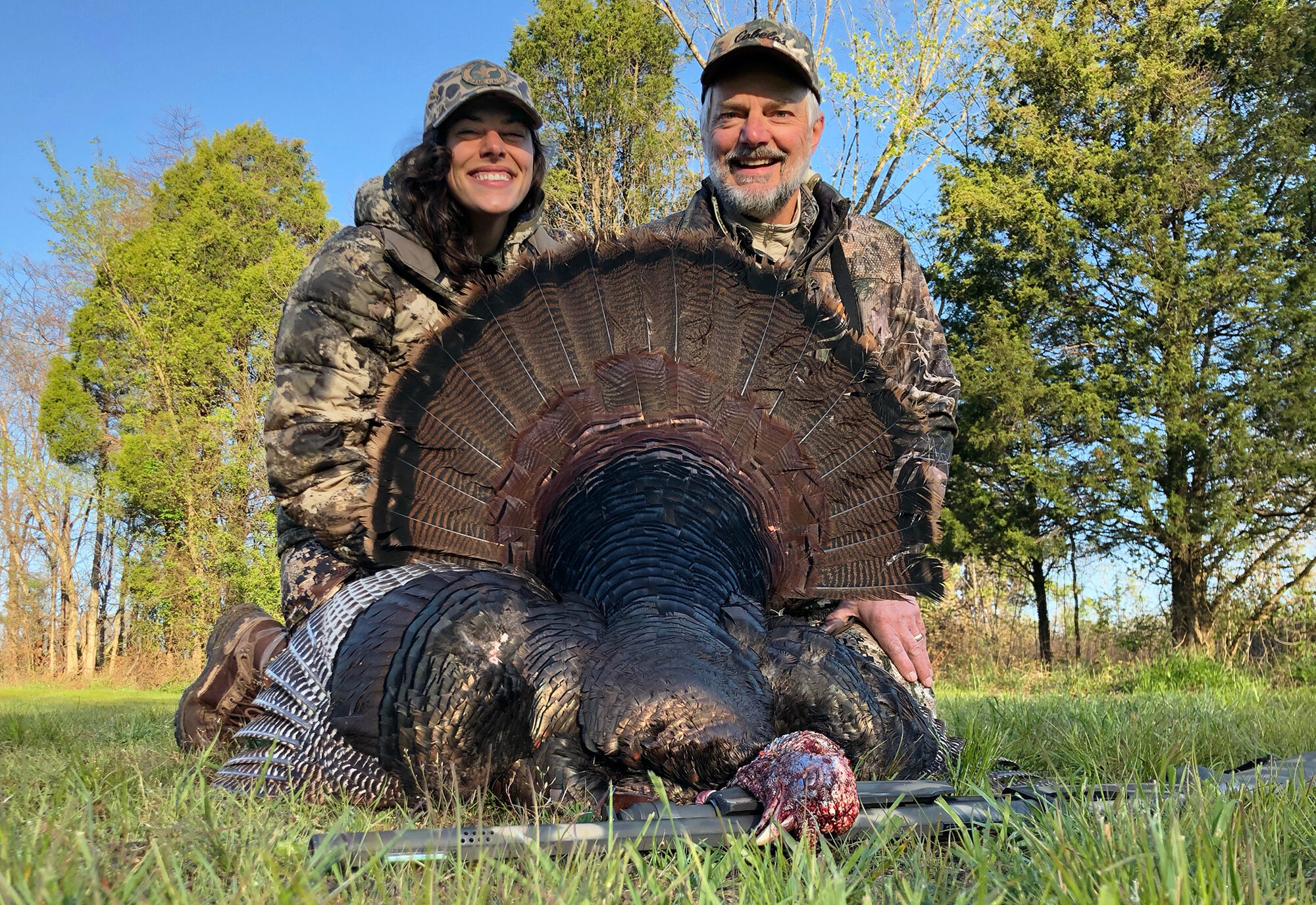 Natalie Krebs with her father after a turkey hunt.