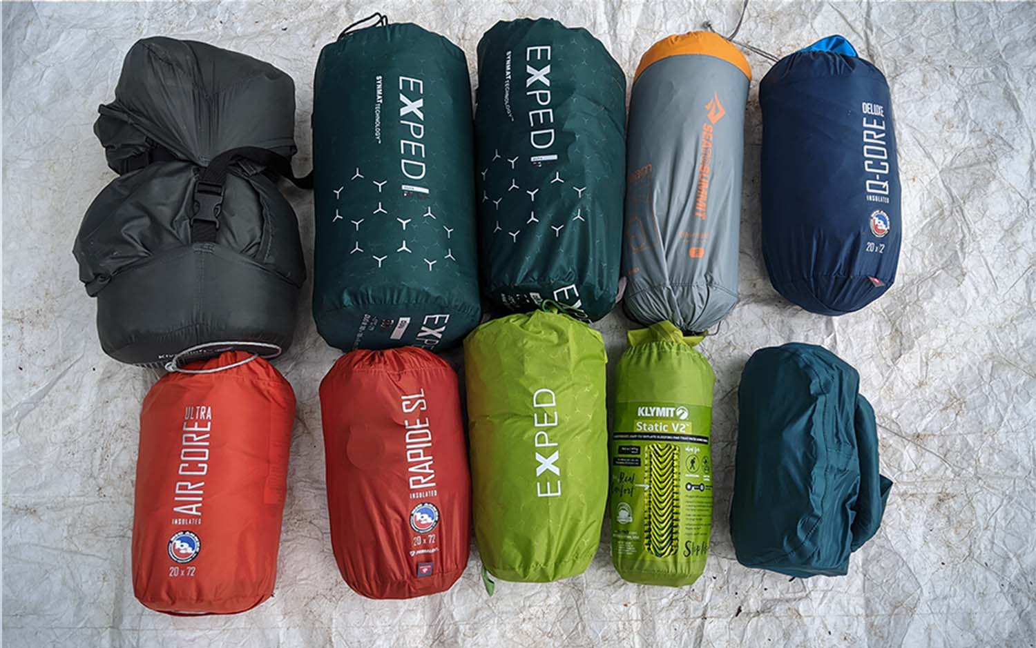 Two rows of backpacking sleeping bag stuff sacks