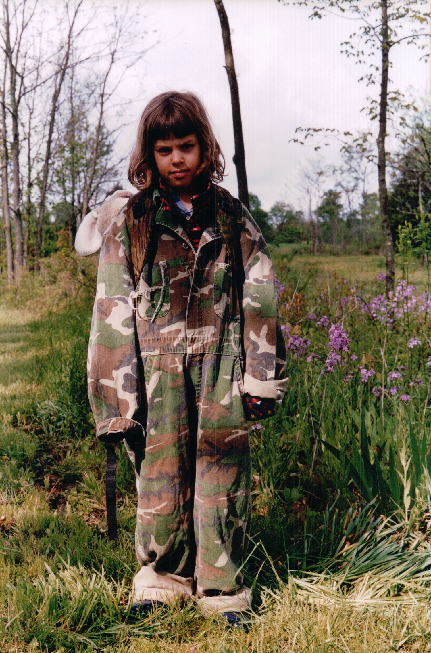 Natalie Krebs in oversized hunting clothes.